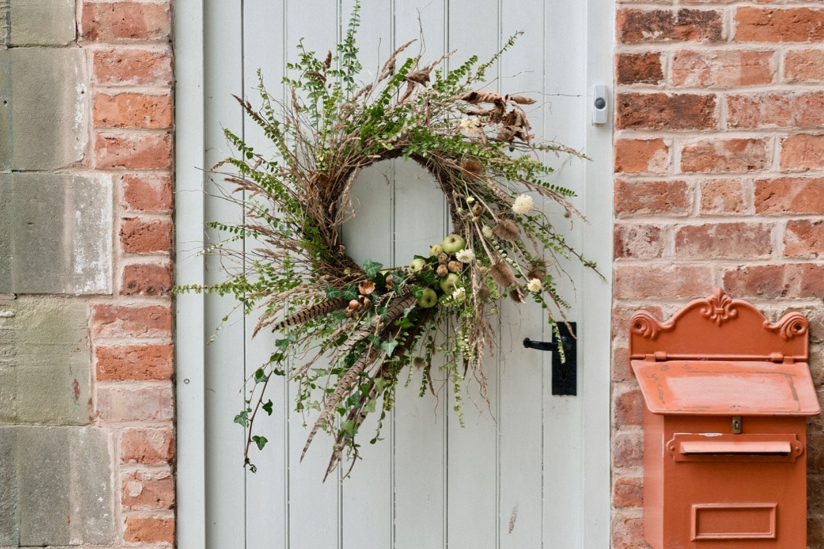 An eco friendly rustic wild garden style autumn wreath made with seasonal British ingredients